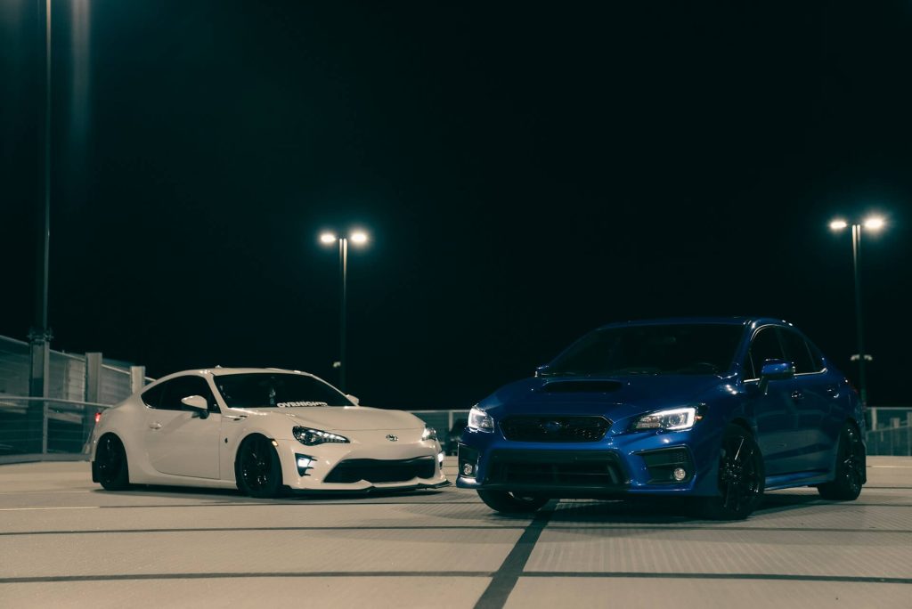 parked white blue sports cars